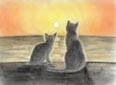 夕日の海を見る2匹の猫
